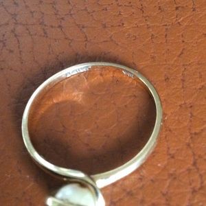 Pearl gold either 14 k or 10 k I know it is stamped but just can’t tell the k